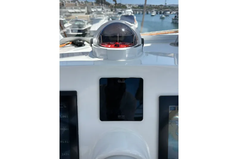 Slide: The Image of Boat dashboard with compass and navigation screens, Bali 4.4 model, 2023, docked at marina. - 39