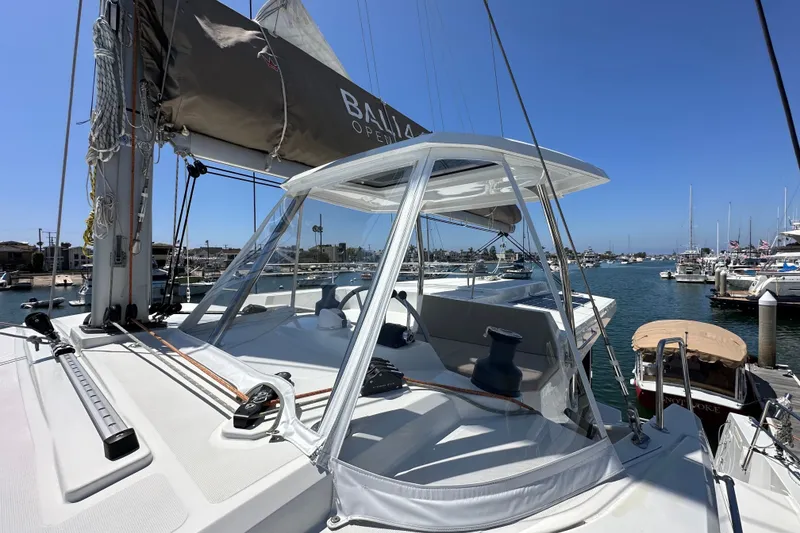 Slide: The Image of Modern Bali 4.4 catamaran docked at marina, showcasing sleek design and spacious deck. - 29