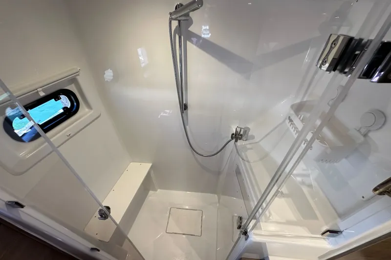 Slide: The Image of Modern shower cabin in 2023 Bali 4.4 model, featuring sleek design and window. - 82