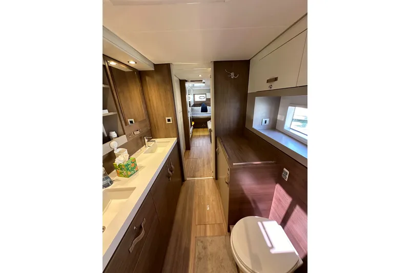 Slide: The Image of Luxurious interior of 2023 Bali 4.4 yacht featuring modern bathroom and wooden finishes. - 84