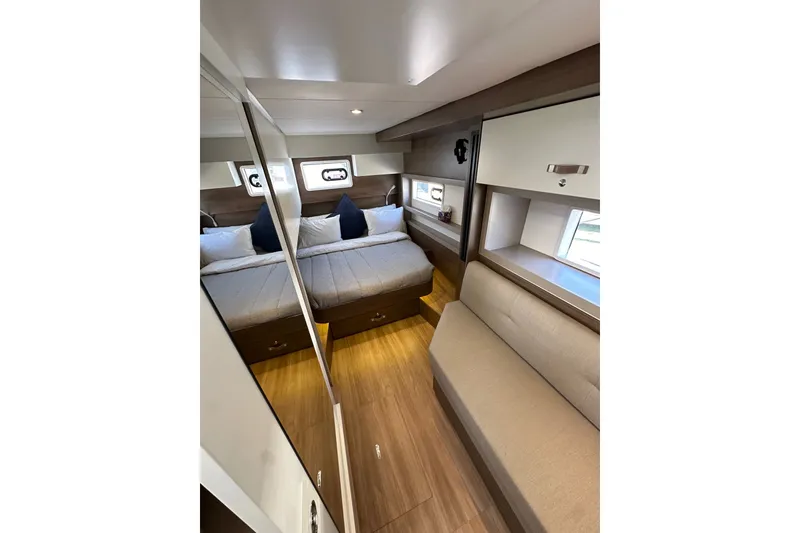 Slide: The Image of Luxurious interior of 2023 Bali 4.4 yacht with cozy bedroom and seating area. - 70