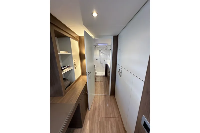 Slide: The Image of Modern interior of 2023 Bali 4.4 yacht with wood flooring and sleek cabinetry. - 76