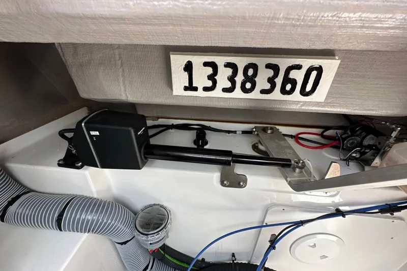 Slide: The Image of Interior view of a 2023 Bali 4.4 boat showing mechanical components and serial number. - 106