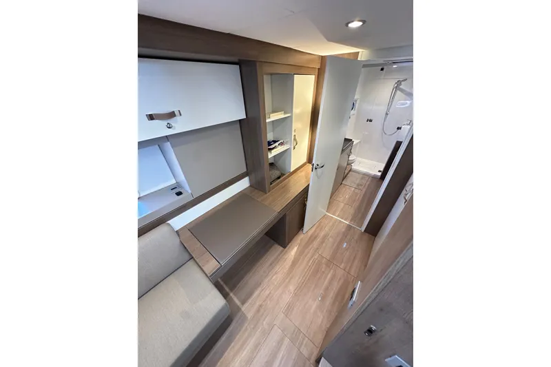 Slide: The Image of Modern interior of 2023 Bali 4.4 yacht with sleek wood finishes and compact bathroom. - 69