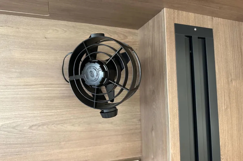 Slide: The Image of Ceiling-mounted black fan in a wooden interior, Bali 4.4 model, 2023. - 74