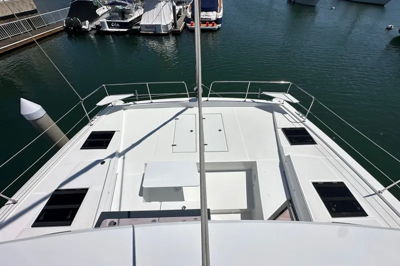 Slide: The Image of Front deck view of 2023 Bali 4.4 yacht docked at marina. - 46