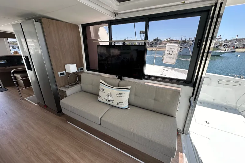 Slide: The Image of Modern interior of 2023 Bali 4.4 yacht with sofa, TV, and ocean view. - 54