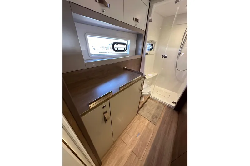 Slide: The Image of Modern bathroom interior in 2023 Bali 4.4 yacht, featuring sleek cabinetry and shower. - 79