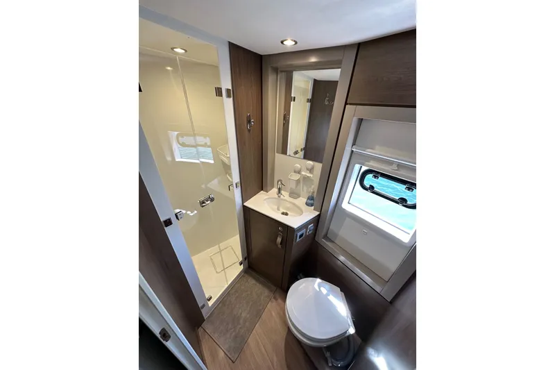 Slide: The Image of Modern bathroom in 2023 Bali 4.4 yacht with shower, sink, and window. - 99