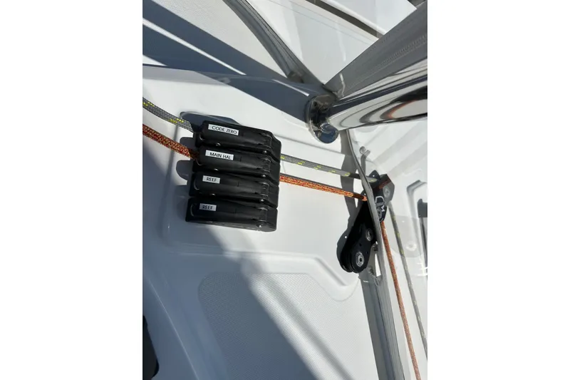 Slide: The Image of Sailing rigging on 2023 Bali 4.4 yacht, featuring labeled ropes and pulleys. - 42