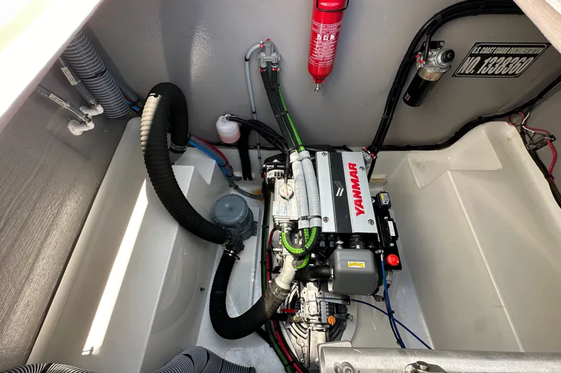 Slide: The Image of Engine compartment of 2023 Bali 4.4 with Yanmar engine and fire extinguisher. - 110