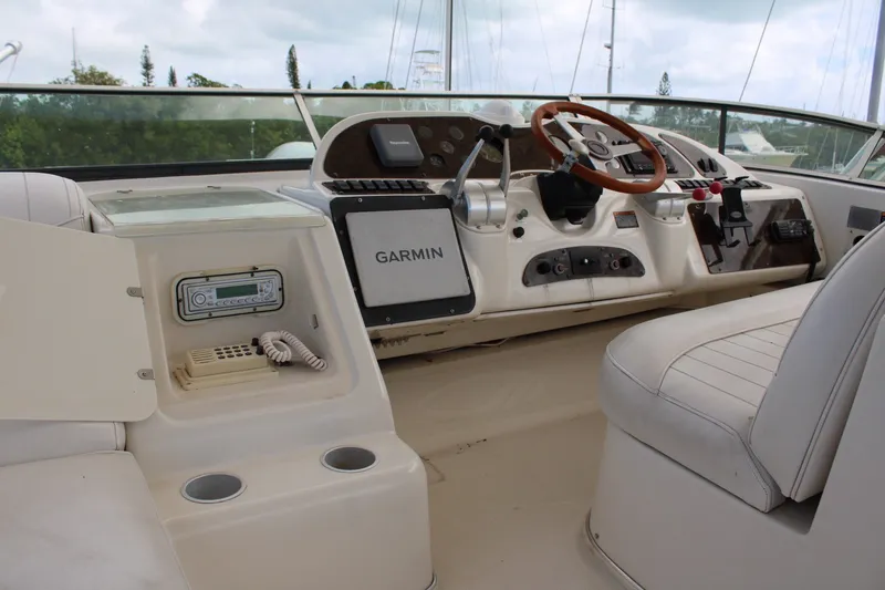 Slide: The Image of Cockpit of 1999 Maxum 4600 SCB yacht with Garmin navigation system and steering wheel. - 28