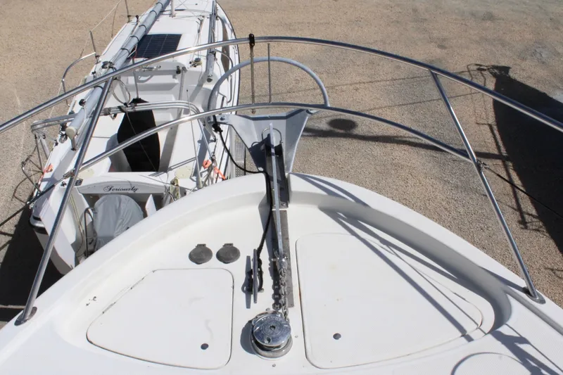 Slide: The Image of Bow view of 1999 Maxum 4600 SCB yacht with anchor and railing. - 30