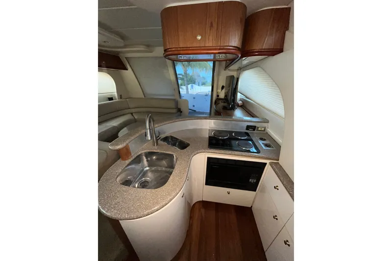 Slide: The Image of Luxurious kitchen interior of 1999 Maxum 4600 SCB yacht with modern amenities. - 11