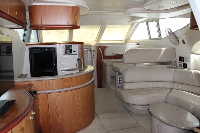 Slide: The Image of Luxurious interior of a 1999 Maxum 4600 SCB yacht with modern amenities. - 9