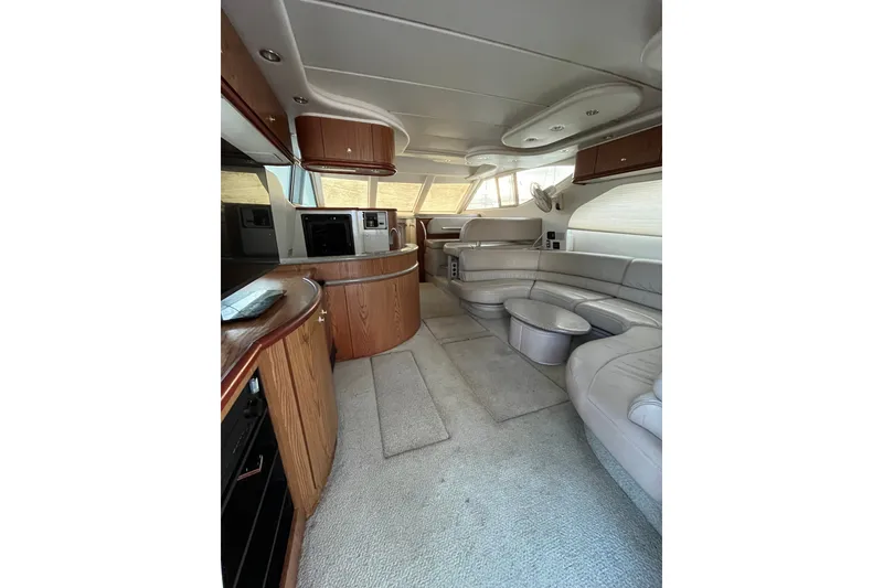 Slide: The Image of Luxurious interior of 1999 Maxum 4600 SCB yacht with plush seating and modern amenities. - 5