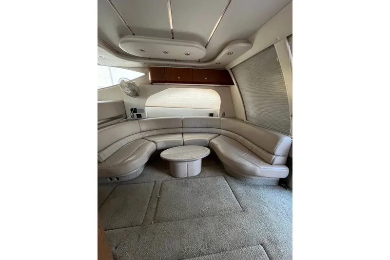 Slide: The Image of Luxurious interior of a 1999 Maxum 4600 SCB yacht with curved leather seating and modern design. - 7