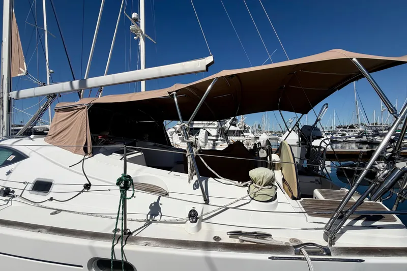 Slide: The Image of 2008 Jeanneau Sun Odyssey 49 DS sailboat docked at marina under clear blue sky. - 11