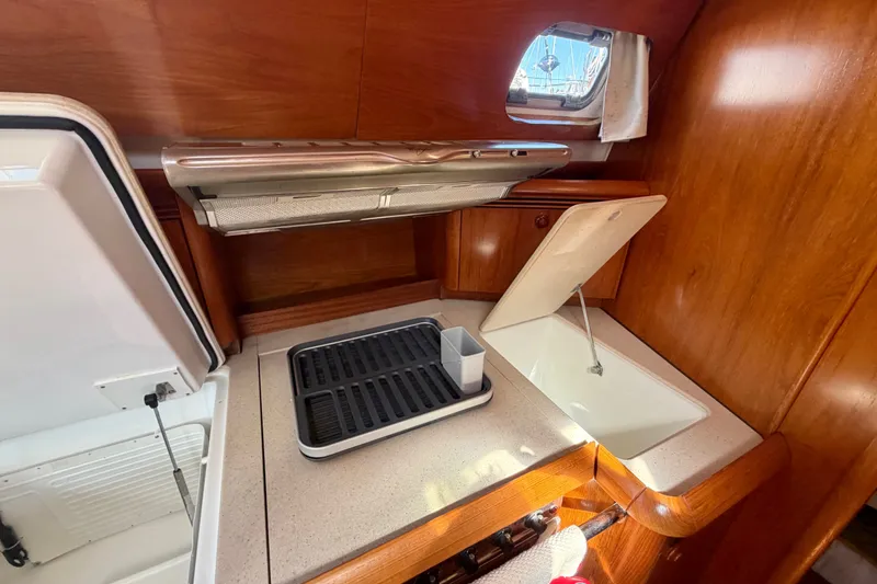 Slide: The Image of 2008 Jeanneau Sun Odyssey 49 DS yacht kitchen with sink and countertop. - 60