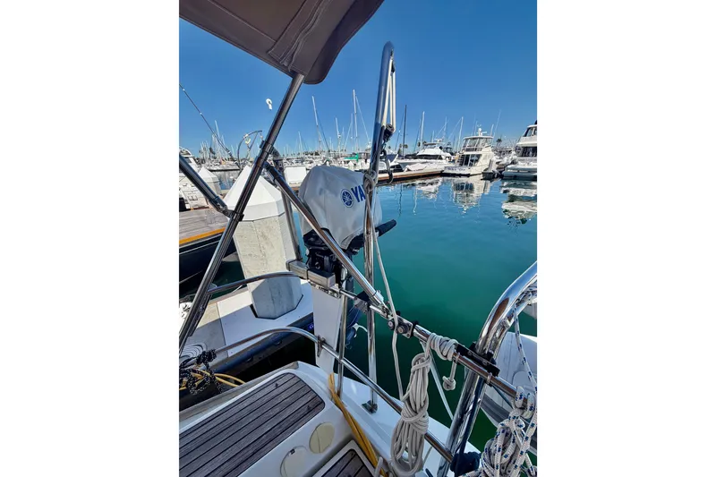 Slide: The Image of Jeanneau Sun Odyssey 49 DS sailboat docked in marina, 2008 model, clear blue sky. - 37