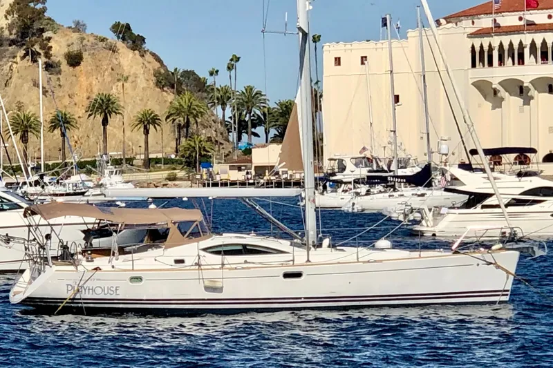 Slide: The Image of 2008 Jeanneau Sun Odyssey 49 DS sailboat docked in a scenic marina. - 1