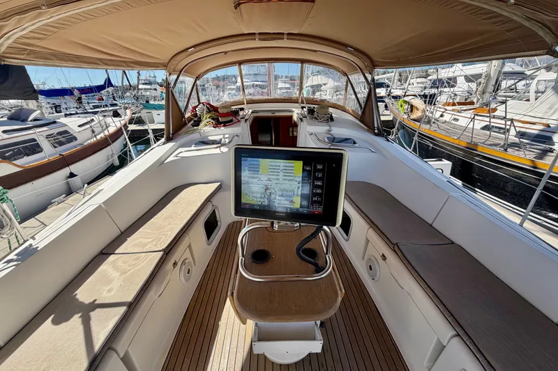 Slide: The Image of 2008 Jeanneau Sun Odyssey 49 DS cockpit with navigation display, docked at marina. - 33