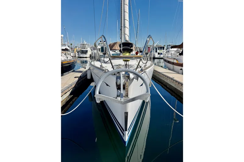 Slide: The Image of 2008 Jeanneau Sun Odyssey 49 DS sailboat docked in a marina, front view. - 6
