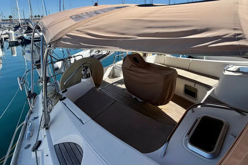Slide: The Image of 2008 Jeanneau Sun Odyssey 49 DS yacht cockpit with canopy, docked at marina. - 12