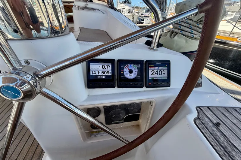 Slide: The Image of Steering wheel and navigation instruments on a 2008 Jeanneau Sun Odyssey 49 DS yacht. - 32