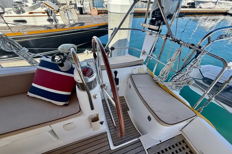 Slide: The Image of Cockpit of 2008 Jeanneau Sun Odyssey 49 DS sailboat with steering wheel and seating. - 22
