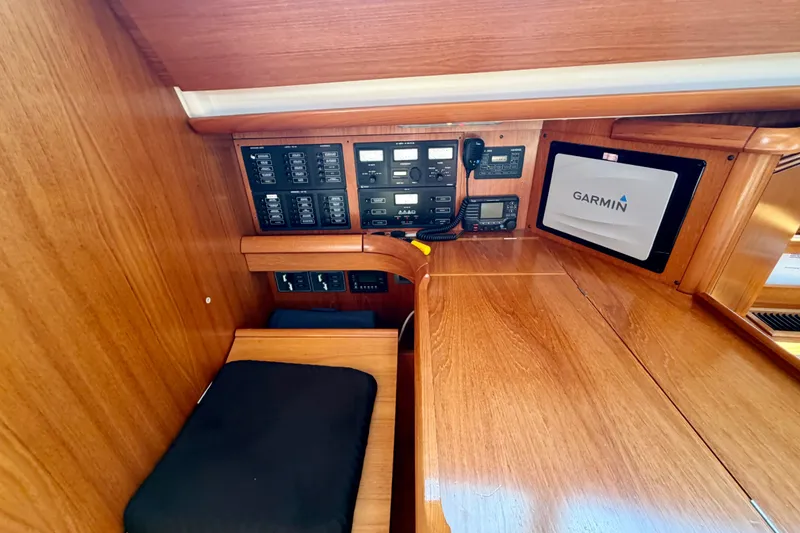 Slide: The Image of Navigation station of 2008 Jeanneau Sun Odyssey 49 DS with Garmin equipment and control panels. - 43
