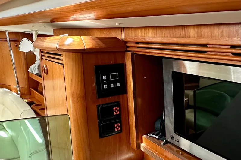 Slide: The Image of Interior of 2008 Jeanneau Sun Odyssey 49 DS yacht with wood paneling and built-in LG microwave. - 45
