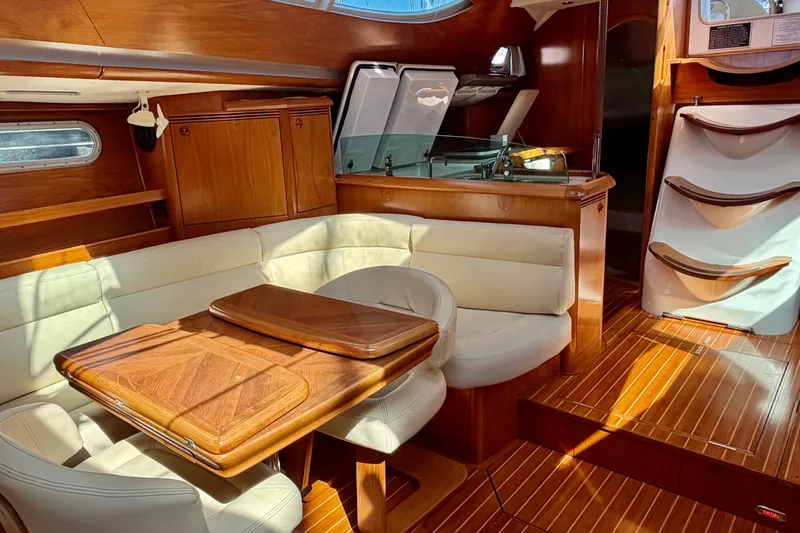 Slide: The Image of Luxurious interior of 2008 Jeanneau Sun Odyssey 49 DS sailboat with wood and leather finishes. - 48
