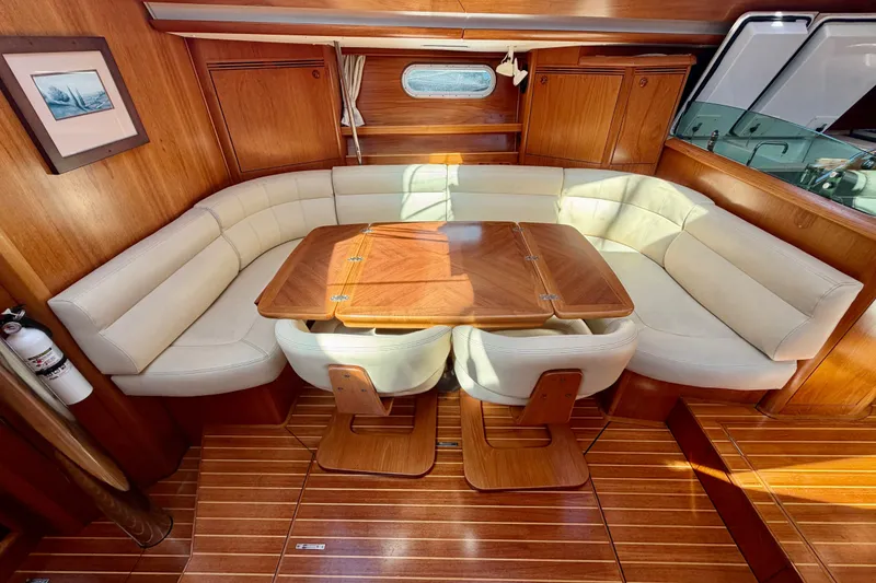 Slide: The Image of Luxurious interior of 2008 Jeanneau Sun Odyssey 49 DS with elegant wood and leather seating. - 52