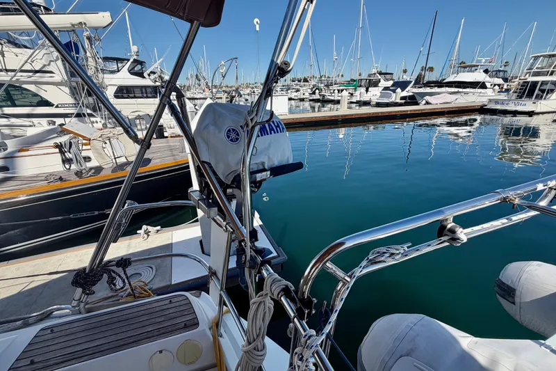 Slide: The Image of 2008 Jeanneau Sun Odyssey 49 DS yacht docked in a marina with clear blue water. - 36