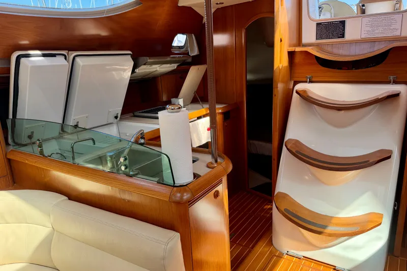 Slide: The Image of Interior of 2008 Jeanneau Sun Odyssey 49 DS yacht with wooden finishes and modern kitchen. - 55