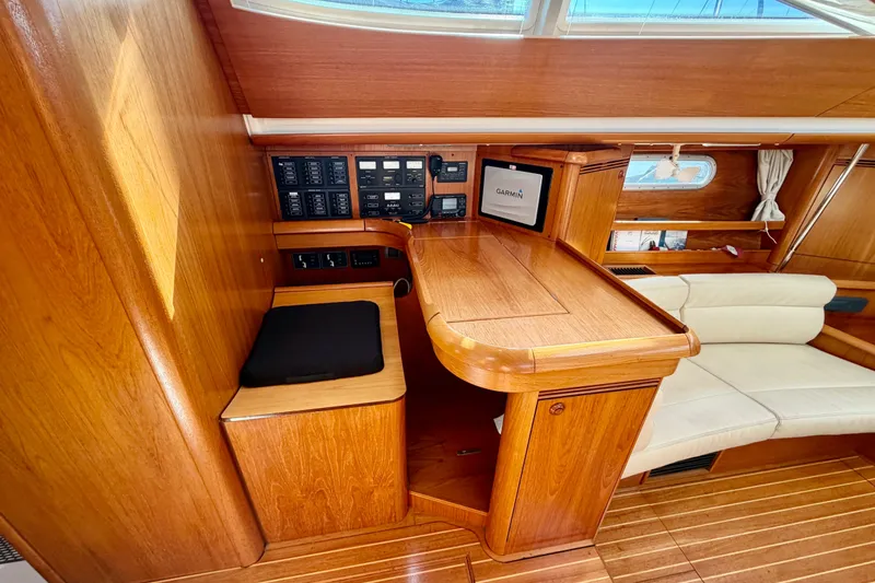 Slide: The Image of Interior of 2008 Jeanneau Sun Odyssey 49 DS yacht with wooden finish and navigation equipment. - 42