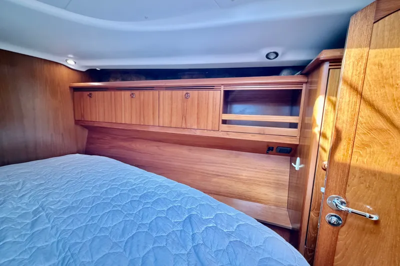Slide: The Image of Interior cabin of 2008 Jeanneau Sun Odyssey 49 DS with wooden cabinetry and bed. - 68