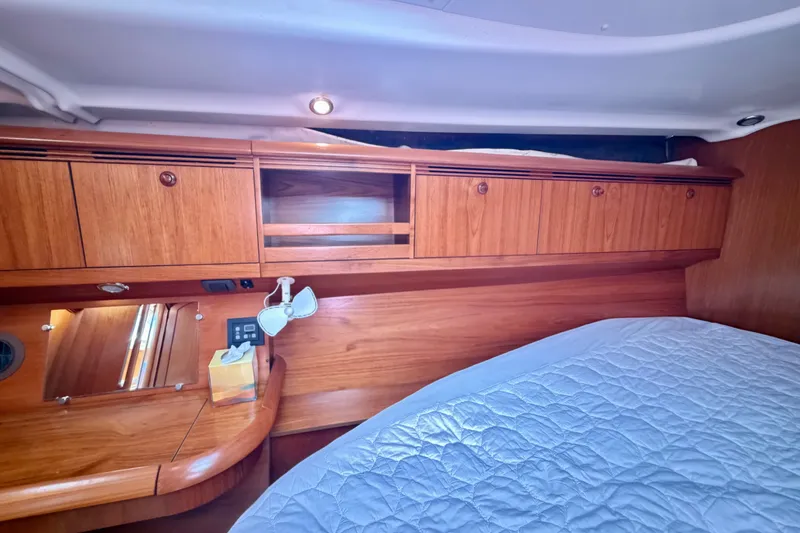 Slide: The Image of Interior cabin of 2008 Jeanneau Sun Odyssey 49 DS with wooden cabinetry and cozy bedding. - 69