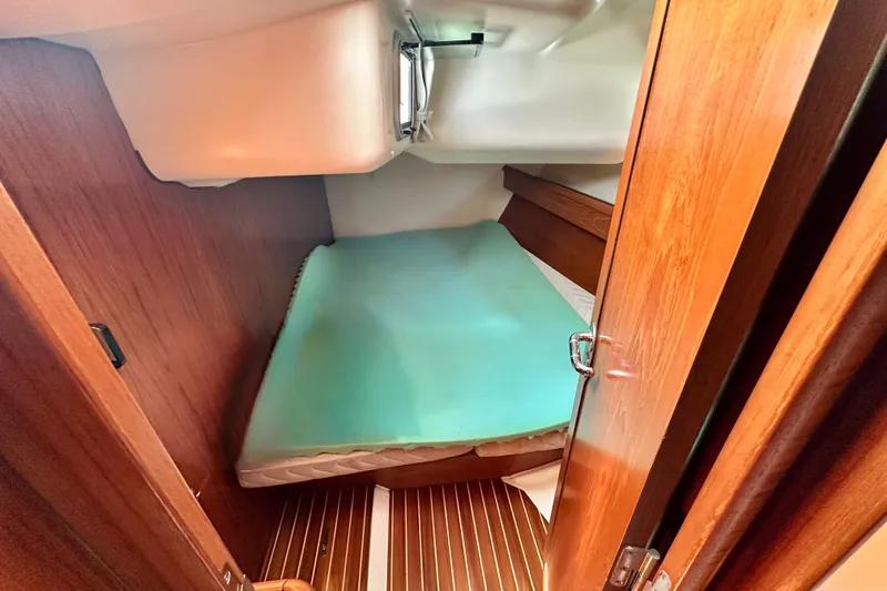 Slide: The Image of Cozy cabin interior of 2008 Jeanneau Sun Odyssey 49 DS sailboat with wooden finish. - 78