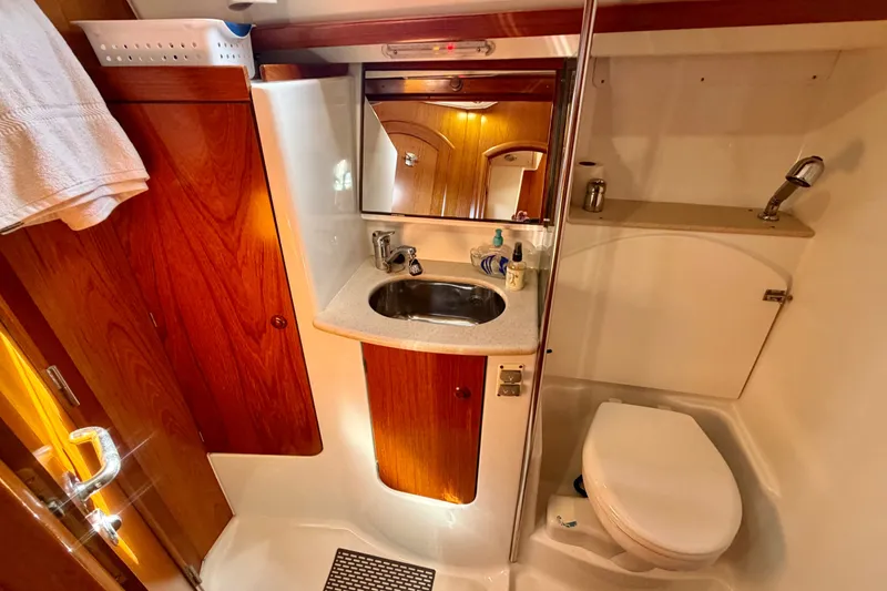 Slide: The Image of Luxurious bathroom in 2008 Jeanneau Sun Odyssey 49 DS yacht, featuring wood accents and modern fixtures. - 80
