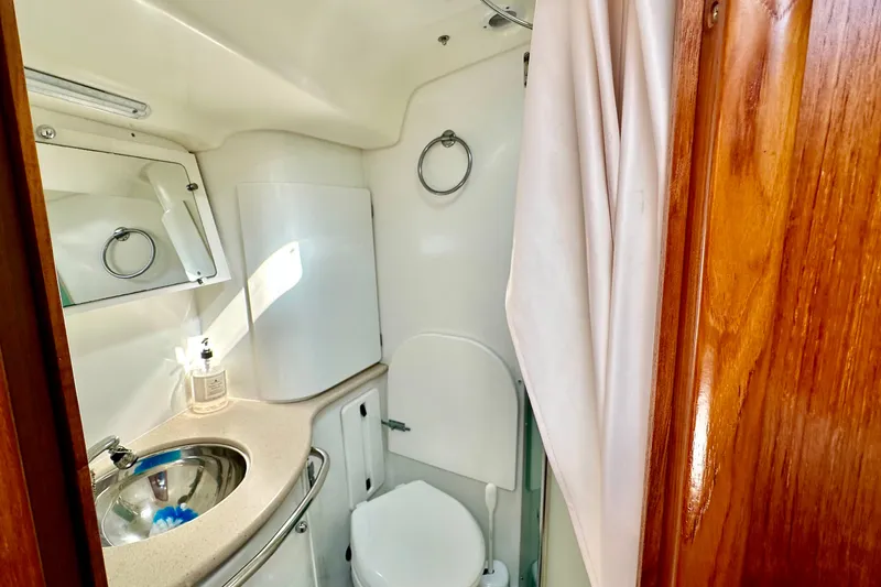 Slide: The Image of Compact bathroom in 2008 Jeanneau Sun Odyssey 49 DS yacht with sink and toilet. - 73