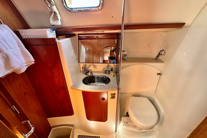 Slide: The Image of Bathroom interior of 2008 Jeanneau Sun Odyssey 49 DS yacht, featuring sink and toilet. - 81