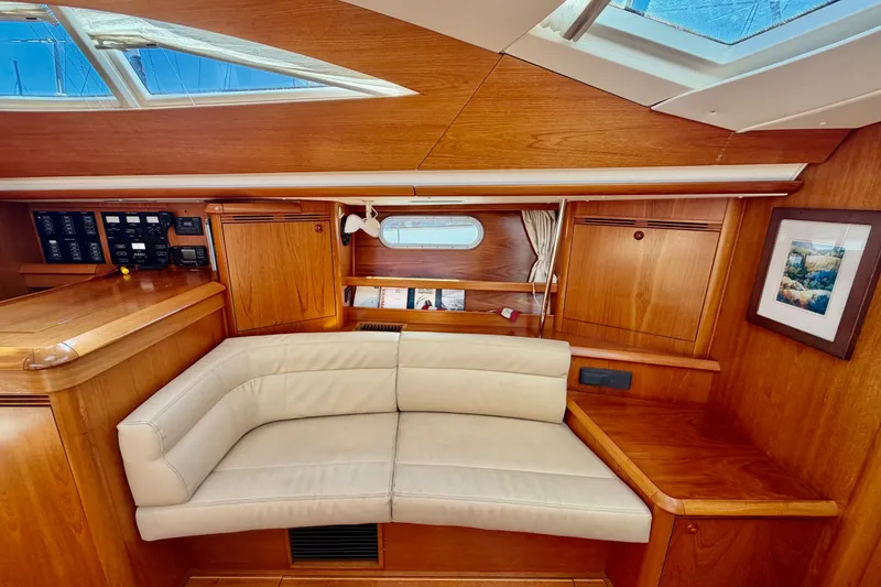 Slide: The Image of Luxurious interior of 2008 Jeanneau Sun Odyssey 49 DS with wood finish and cream seating. - 50