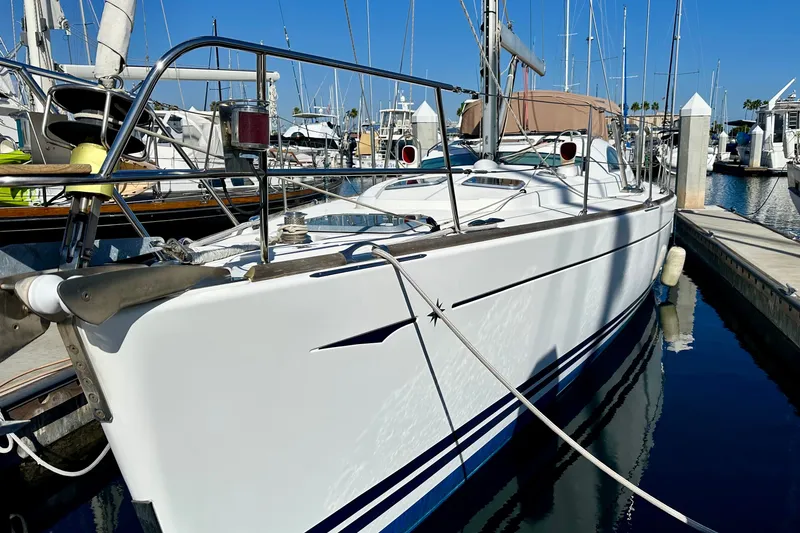 Slide: The Image of 2008 Jeanneau Sun Odyssey 49 DS sailboat docked at marina under clear blue sky. - 9