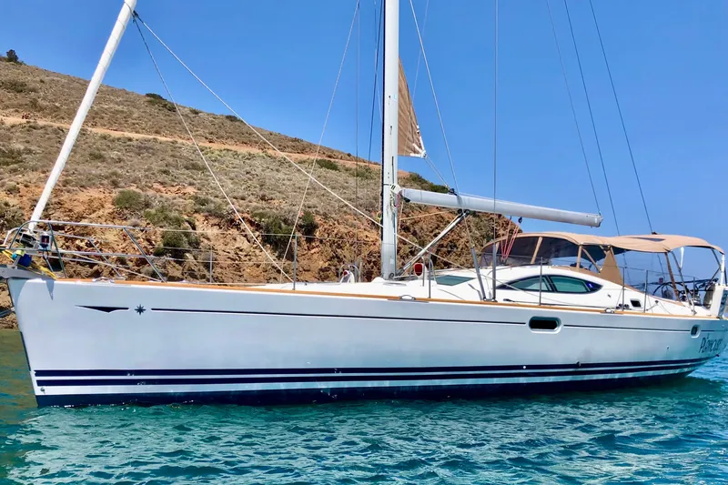 The Image of 2008 Jeanneau Sun Odyssey 49 DS sailboat on clear blue water. - 0