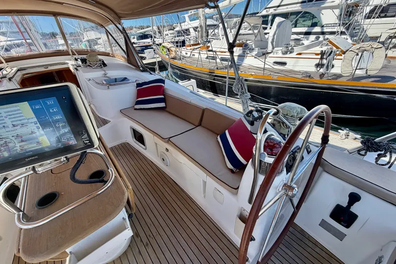 Slide: The Image of Cockpit of 2008 Jeanneau Sun Odyssey 49 DS sailboat with navigation equipment and seating. - 21