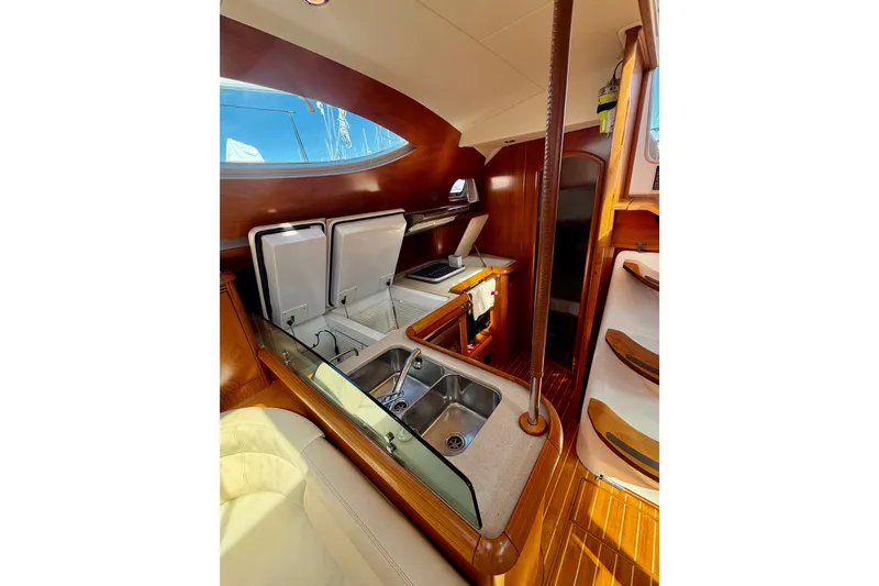 Slide: The Image of Interior of 2008 Jeanneau Sun Odyssey 49 DS yacht, featuring a modern kitchen area. - 57