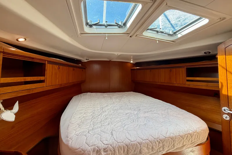 Slide: The Image of Luxurious cabin interior of 2008 Jeanneau Sun Odyssey 49 DS sailboat with skylights. - 66