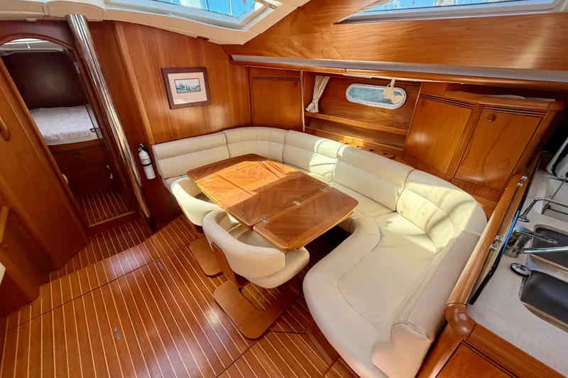 Slide: The Image of Luxurious interior of 2008 Jeanneau Sun Odyssey 49 DS yacht with elegant wood finish. - 53
